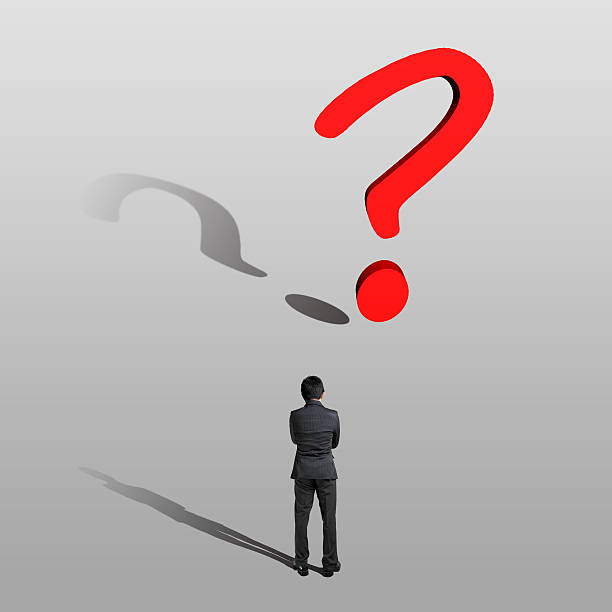 istock Thoughtful businessman with a big question mark 186126081