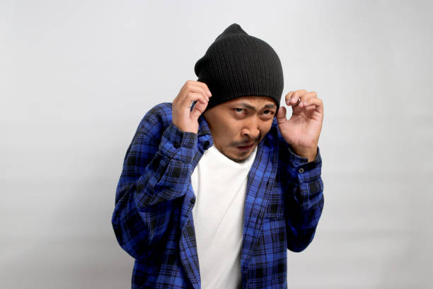 istock Worried young Asian student appears anxious about facing challenging question during the final exam 1861261514