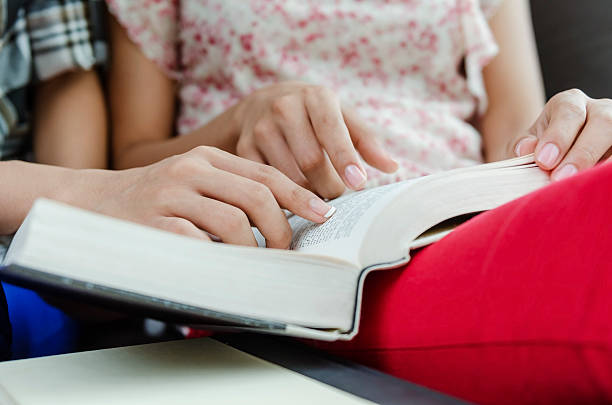 istock Closeup of human hand reading 186128299