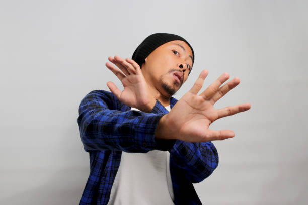 istock Displeased young Asian man wears a disgusted expression while visibly repulsed by something 1861294958