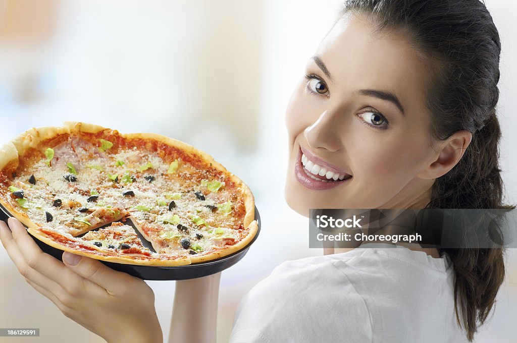 delicious pizza Girl eating a delicious pizza One Woman Only Stock Photo