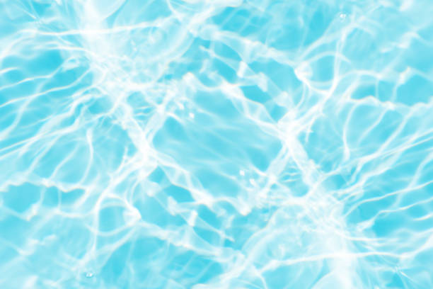 istock Bluewater bubbles on the surface ripples. Defocus blurred transparent white-black colored clear calm water surface texture with splash and bubbles. Water waves with shining pattern texture background. 1861296488