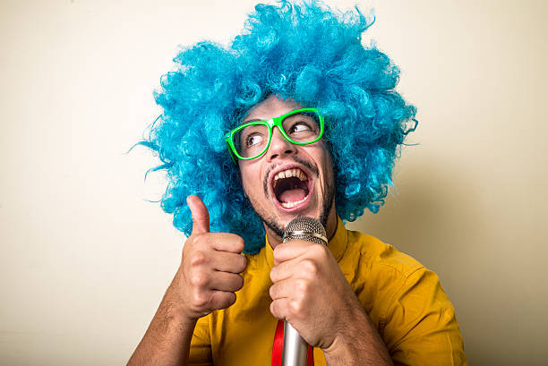 istock crazy funny young man with blue wig 186129779