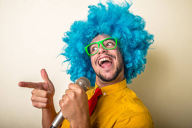 istock crazy funny young man with blue wig 186129806