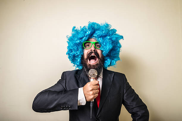 istock crazy funny bearded man with blue wig 186129963