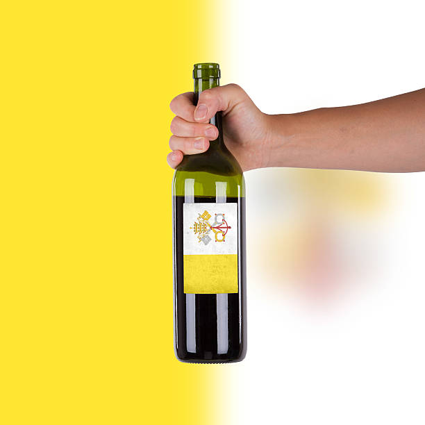 istock Hand holding a bottle of red wine 186130017