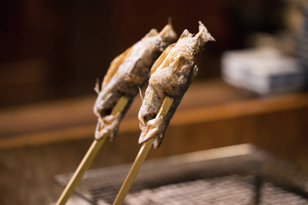 istock Fish being grilled on the hearth Close-up 1861303193