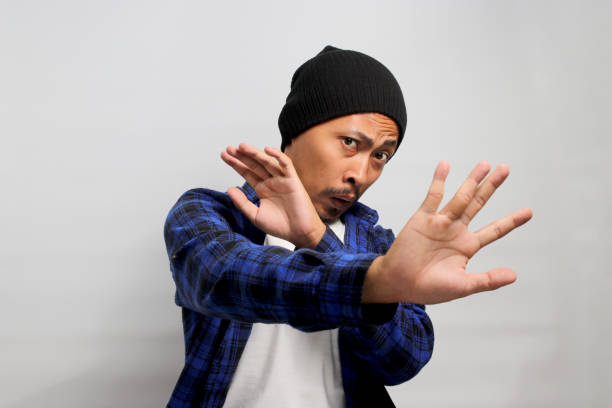 istock Displeased young Asian man wears a disgusted expression while visibly repulsed by something 1861303216