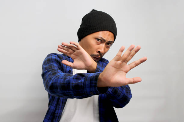 istock Displeased young Asian man wears a disgusted expression while visibly repulsed by something 1861308655