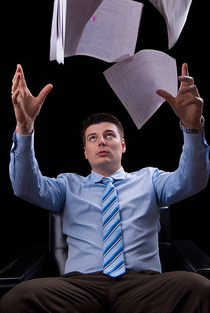 istock Young businessman throws the papers 186131150