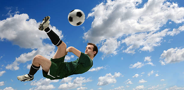 istock Soccer Player Kicking Ball 186131292