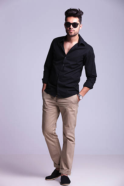 istock young fashion man with both hands in pockets 186131924