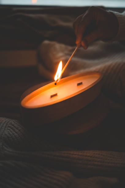 istock A match lights a candle in wood 1861329916