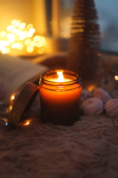 istock Burning candle in a festive cozy atmosphere 1861329923