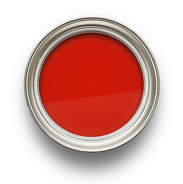 Opened can of red paint from above
