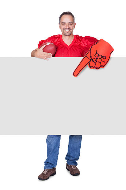 istock Rugby Player Holding Ball And Placard 186133936