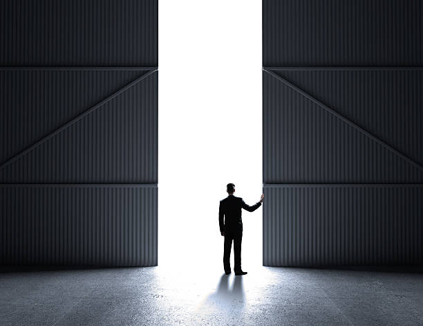 istock businessman open doors 186135844