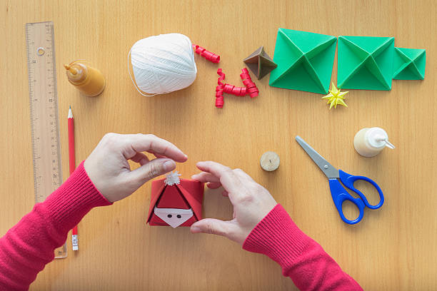 istock Female hands making Christmas decorations 186136780