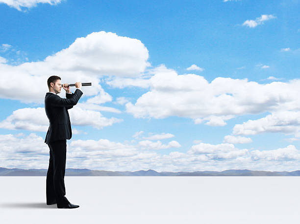 istock businessman with telescope 186140000