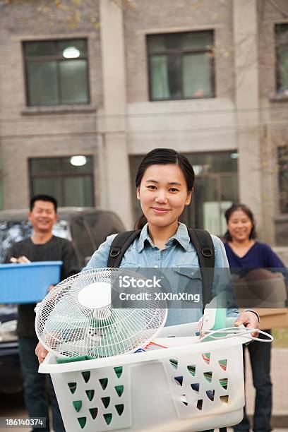 Student Portrait In Front Of Dormitory At College With Family Stock Photo - Download Image Now