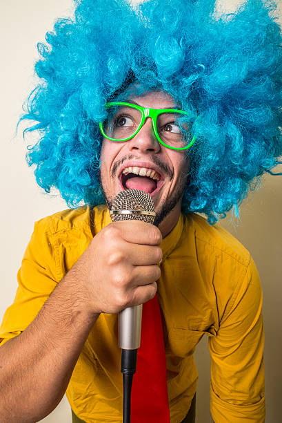 istock crazy funny young man with blue wig 186140423