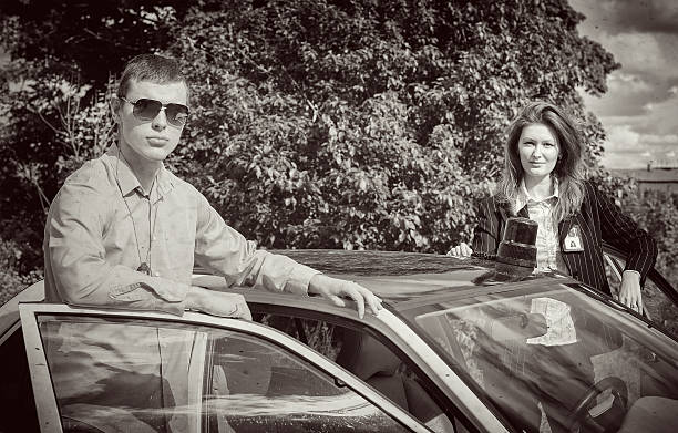 istock Two FBI agents near the car with flasher 186142811