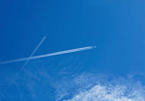 traces of the aircraft in the sky's the letter x