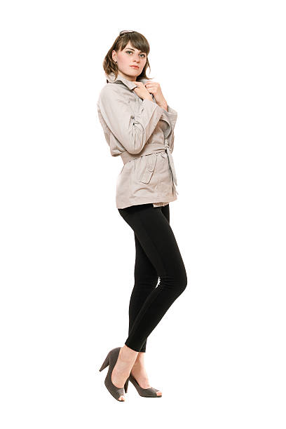 istock Nice young woman wearing a coat and black leggings 186143577