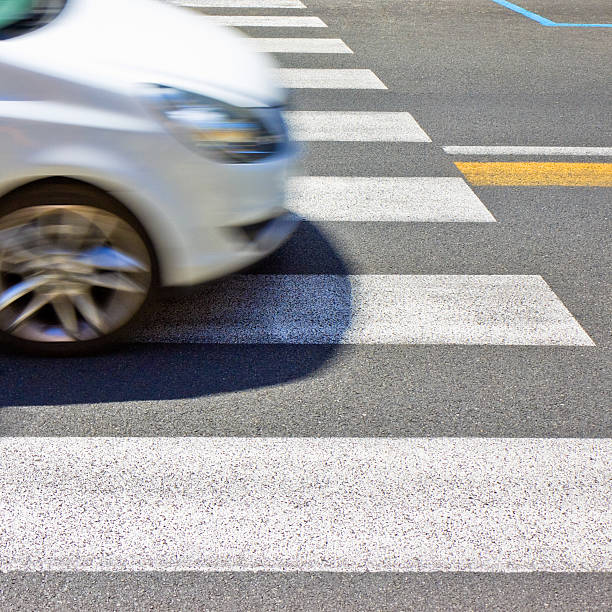 istock Pedestrian crossing with passing car 186143788
