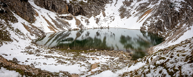 Panorama of Late Autumn Lower Alpine Lake of Kriski Podi Already Covered with First Snow - One of the Three Highest Placed Lakes in Slovenia