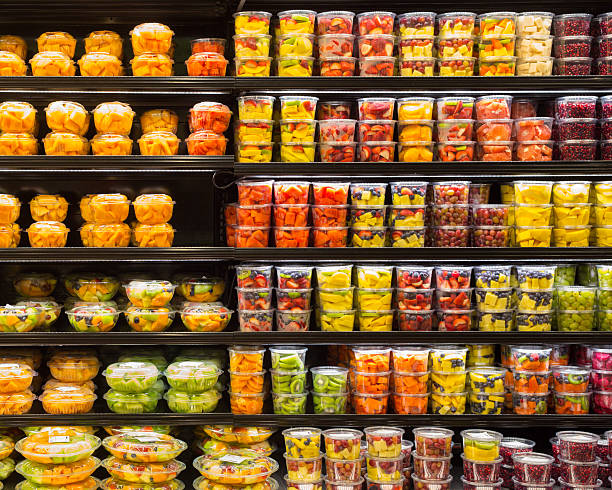 Fruit Display Assortment of cut fruit in containers on display for sale food state stock pictures, royalty-free photos & images