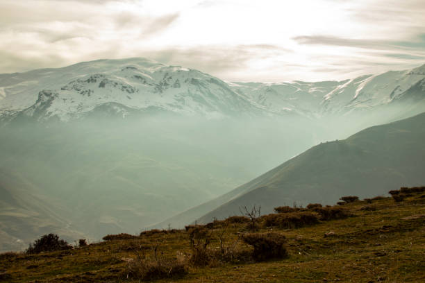 istock snowy mountain landscape and fog 1861446013