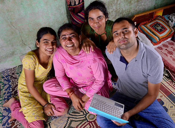 istock Indian Family Holding Laptop 186144659