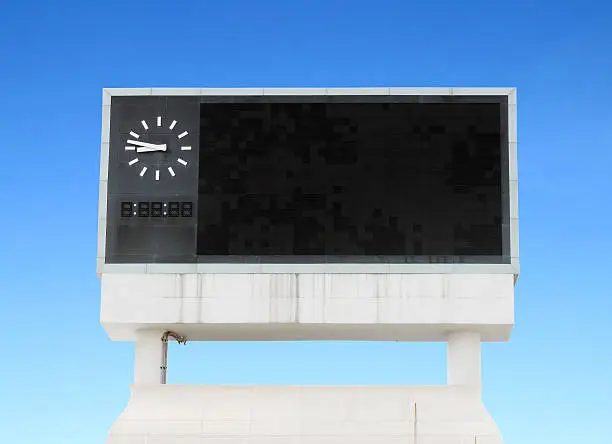 score board at football stadium with bluesky