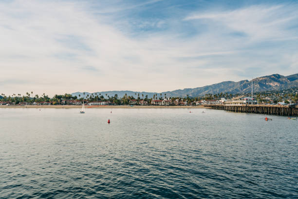 istock Santa Barbara harbor sunset. Quiet water, mountains, and a beautiful sunset sky 1861453959