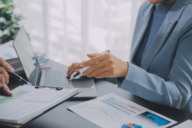 istock Financial Business team present. Business man hands hold documents with financial statistic stock photo, discussion, and analysis report data the charts and graphs. Finance Financial concept 1861460774