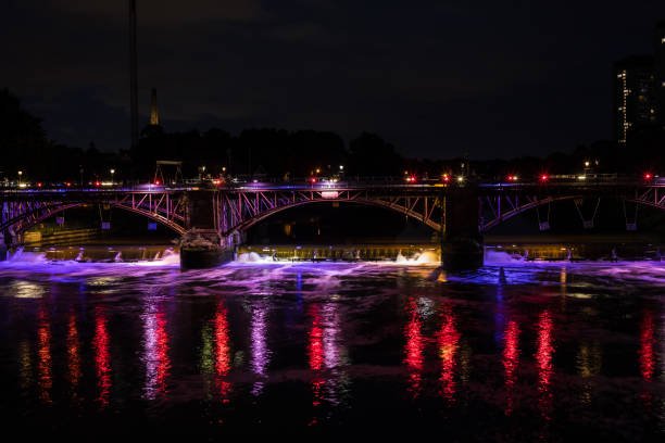 istock Bridge Illuminated in Radiant Purple and Red Hues 1861472282