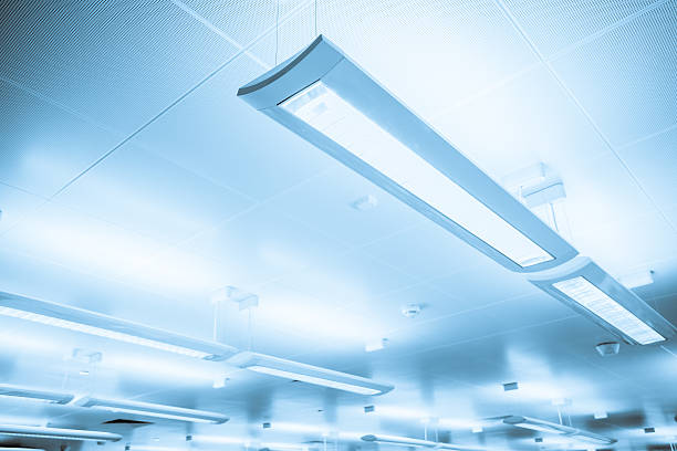 istock Close-up of some indoor lighting bars hanging from ceiling 186147588