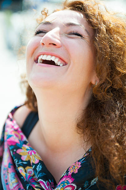 istock Happy young woman laughing 186148314