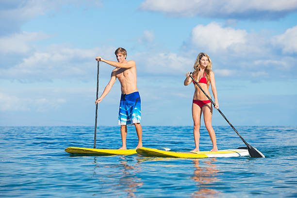 istock Couple Stand Up Paddling in Hawaii 186149147