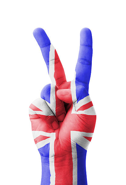 istock Hand making the V sign, UK (United Kingdom) flag painted 186151044