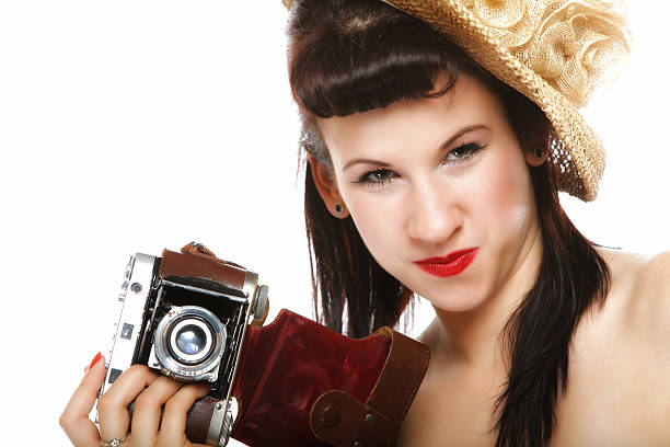 istock Pretty retro girl in hat with vintage camera 186151130