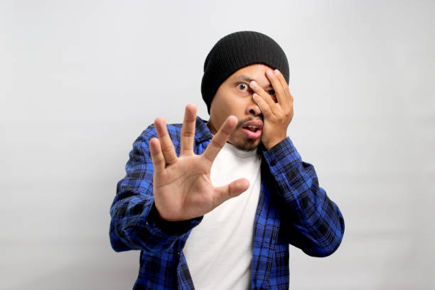 istock Asian man is covering his eyes 1861529658