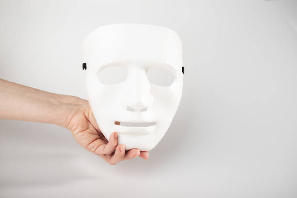 istock White mask in hand, theatrical face, acting courses, elegant theatre accessory, cabaret stage presence 1861533673