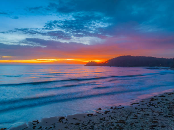 istock Summer Sunrise Seascape with Rain Clouds 1861552378