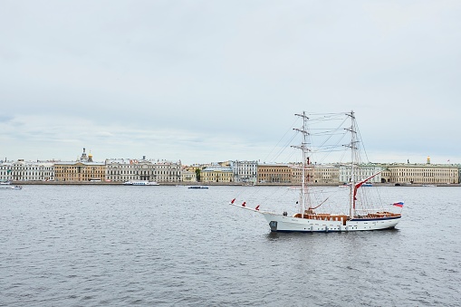 Saint Petersburg, Russia - May 27, 2021: A ship with scarlet sails. The sails are folded and the ship is being prepared for sailing