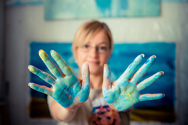 istock beautiful blonde woman painter 186156647