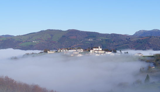 Orendain. The municipality of Orendain appears between the mists of dawn in the region of tolosaldea, province of Gipuzkoa, Basque Country.