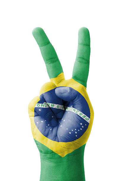 istock Hand making the V sign, Brazil flag painted 186157538