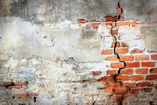 istock cracked concrete vintage brick wall background 186158208